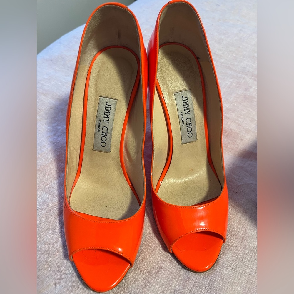 Jimmy Choo neon orange thin wedges.